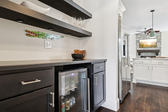 2809 Vaulx Ln, Nashville, TN 37204 - indoor dry bar with beverage cooler, dark wood-style floors, stainless steel fridge with ice dispenser, and ceiling fan