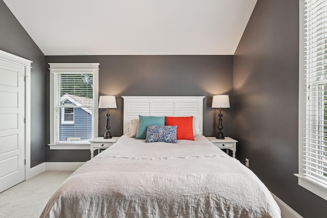 2809 Vaulx Ln, Nashville, TN 37204 - carpeted bedroom featuring lofted ceiling and baseboards