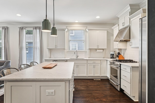 2809 Vaulx Ln, Nashville, TN 37204 - kitchen with stainless steel appliances, under cabinet range hood, dark wood-type flooring, white cabinetry, and recessed lighting