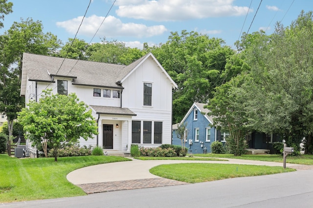 2809 Vaulx Ln, Nashville, TN 37204 - view of front facade with board and batten siding, a front lawn, and roof with shingles