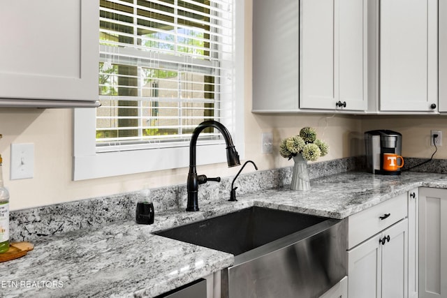 837 Majestic Mountains Blvd, Walland, TN 37886 - kitchen featuring a sink, light stone countertops, and white cabinetry
