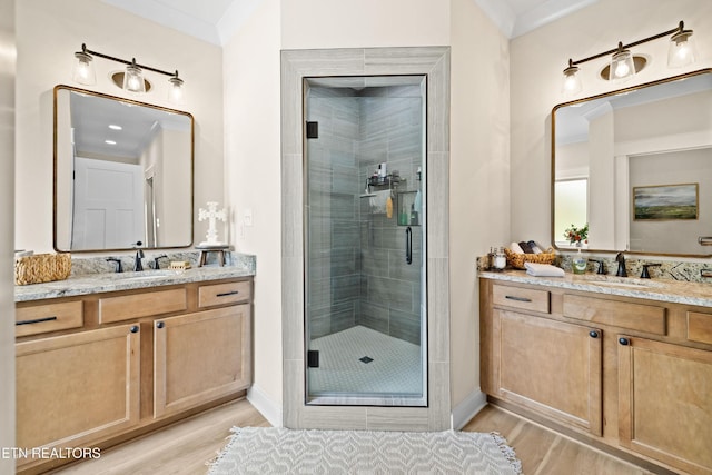 837 Majestic Mountains Blvd, Walland, TN 37886 - bathroom featuring wood finished floors, a stall shower, two vanities, and baseboards