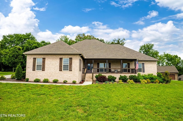 837 Majestic Mountains Blvd, Walland, TN 37886 - ranch-style home featuring covered porch, brick siding, a front lawn, and a shingled roof