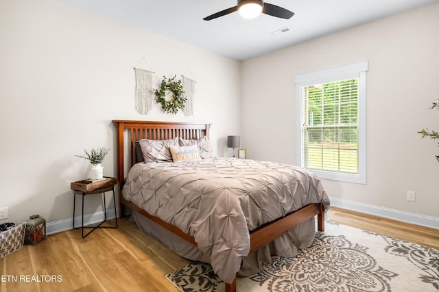 837 Majestic Mountains Blvd, Walland, TN 37886 - bedroom with light wood-type flooring, baseboards, and a ceiling fan