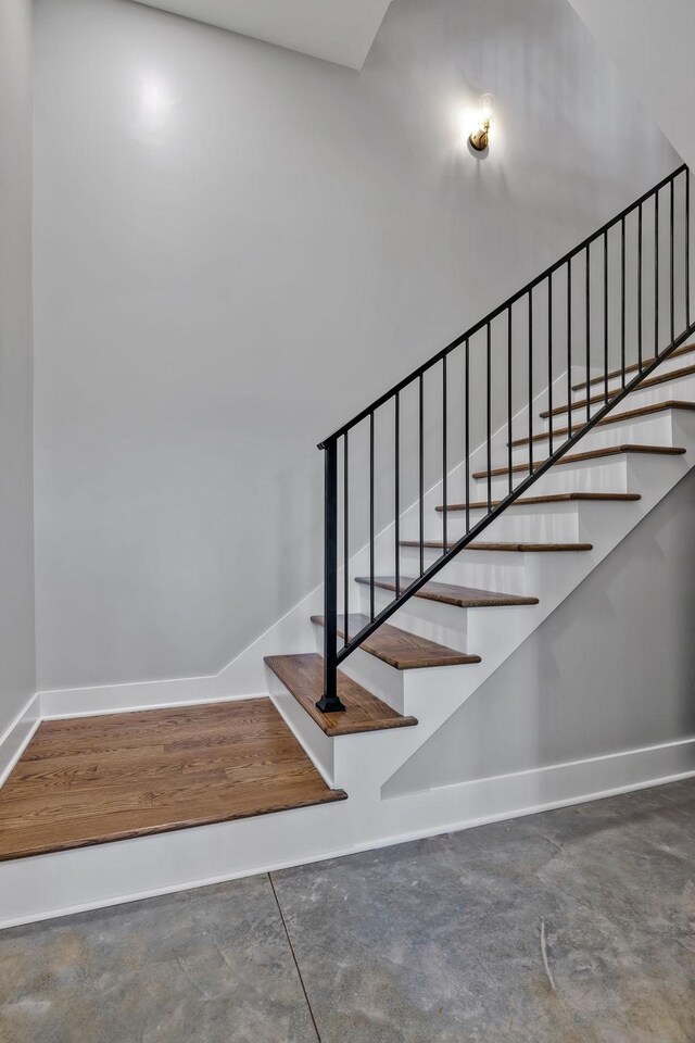 337 Lake Court Dr, Lynchburg, TN 37352 - stairway with baseboards and concrete flooring