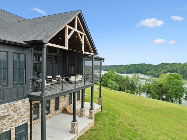 337 Lake Court Dr, Lynchburg, TN 37352 - view of grassy yard featuring a patio area, a water view, a sunroom, and a balcony