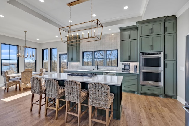 337 Lake Court Dr, Lynchburg, TN 37352 - kitchen with green cabinets, a chandelier, stainless steel appliances, light countertops, and recessed lighting