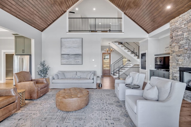 337 Lake Court Dr, Lynchburg, TN 37352 - living room with wooden ceiling, stairs, wood finished floors, high vaulted ceiling, and a chandelier