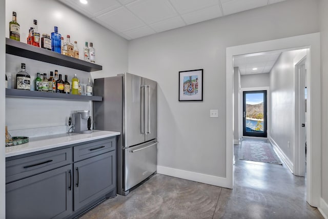 337 Lake Court Dr, Lynchburg, TN 37352 - indoor dry bar with freestanding refrigerator, baseboards, concrete floors, a drop ceiling, and recessed lighting