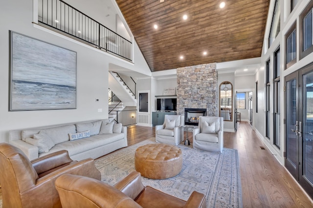 337 Lake Court Dr, Lynchburg, TN 37352 - living area featuring wood ceiling, wood finished floors, recessed lighting, high vaulted ceiling, and stairs