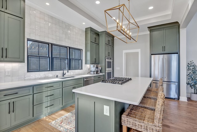 337 Lake Court Dr, Lynchburg, TN 37352 - kitchen featuring appliances with stainless steel finishes, green cabinetry, a sink, light wood-style floors, and recessed lighting