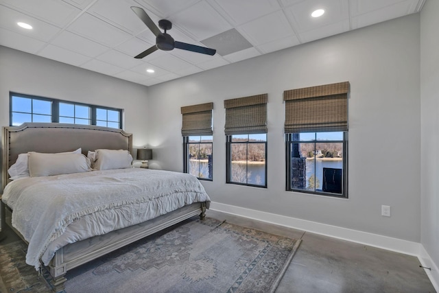 337 Lake Court Dr, Lynchburg, TN 37352 - bedroom featuring baseboards, concrete flooring, ceiling fan, and recessed lighting