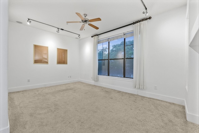 2600 Hillsboro Pike # 233, Nashville, TN 37212 - carpeted empty room with rail lighting, ceiling fan, and baseboards