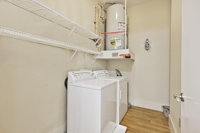 2600 Hillsboro Pike # 233, Nashville, TN 37212 - washroom with washing machine and clothes dryer, light wood-type flooring, and baseboards