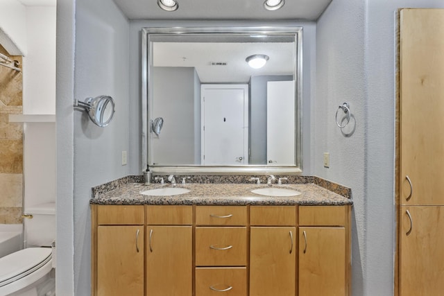 2600 Hillsboro Pike # 233, Nashville, TN 37212 - bathroom featuring double vanity, toilet, and a textured wall