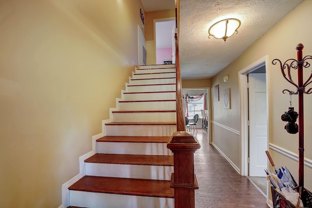 1611 Saltlick Pl, Murfreesboro, TN 37129 - stairs with a textured ceiling, wood finished floors, and baseboards