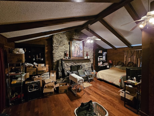 1611 Saltlick Pl, Murfreesboro, TN 37129 - bedroom featuring wood finished floors, a textured ceiling, a ceiling fan, and a fireplace