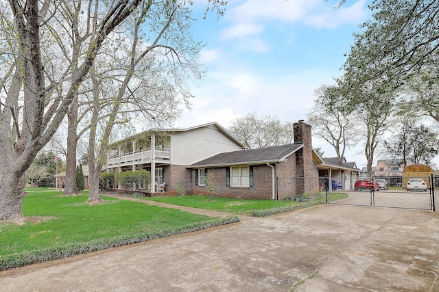 1611 Saltlick Pl, Murfreesboro, TN 37129 - view of front facade with a gate, concrete driveway, brick siding, a chimney, and a balcony
