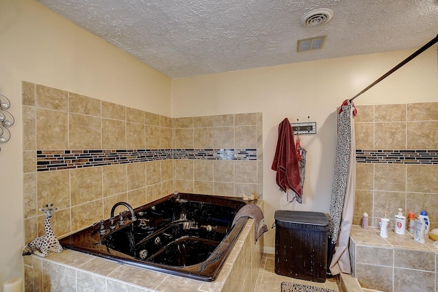1611 Saltlick Pl, Murfreesboro, TN 37129 - bathroom with a jetted tub, a textured ceiling, curtained shower, and tile patterned flooring