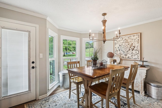 3411 Murphy Ln, Columbia, TN 38401 - dining room featuring a chandelier, crown molding, light wood-style floors, and a textured ceiling