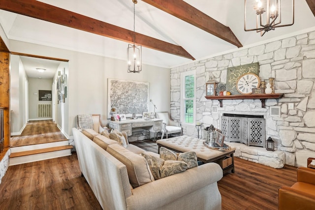 3411 Murphy Ln, Columbia, TN 38401 - living room featuring a chandelier, wood finished floors, and a fireplace