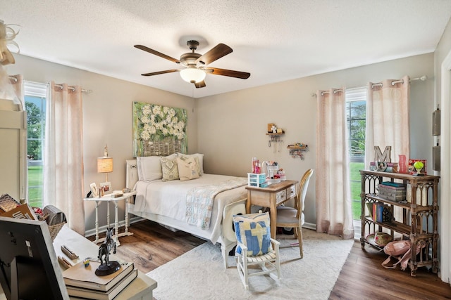 3411 Murphy Ln, Columbia, TN 38401 - bedroom featuring multiple windows, wood finished floors, ceiling fan, and a textured ceiling
