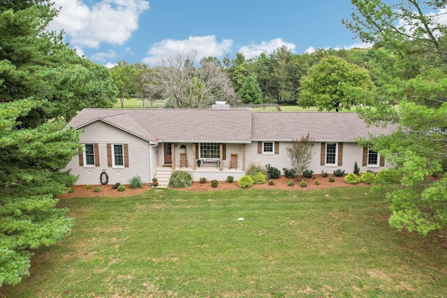 3411 Murphy Ln, Columbia, TN 38401 - ranch-style house with covered porch, a front lawn, brick siding, a chimney, and roof with shingles
