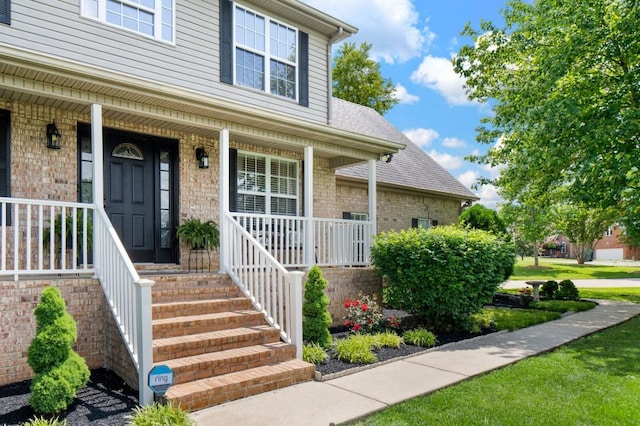 1243 Curtis Dr, Lebanon, TN 37087 - entrance to property with brick siding, covered porch, and a shingled roof