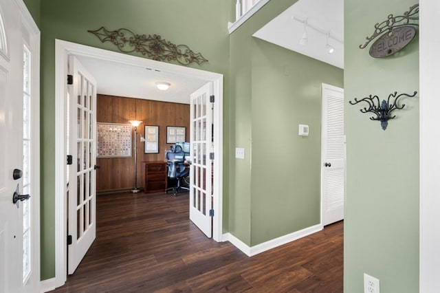 1243 Curtis Dr, Lebanon, TN 37087 - entryway featuring french doors, dark wood-style floors, baseboards, track lighting, and wood walls