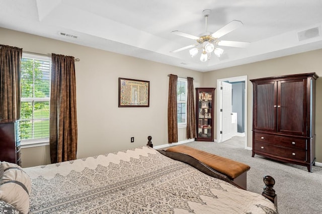 1243 Curtis Dr, Lebanon, TN 37087 - carpeted bedroom featuring baseboards, a raised ceiling, and a ceiling fan