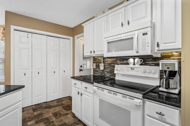1243 Curtis Dr, Lebanon, TN 37087 - kitchen featuring white appliances, backsplash, white cabinetry, and stone finish floors