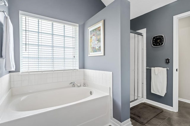 1243 Curtis Dr, Lebanon, TN 37087 - bathroom featuring a bath, tile patterned floors, baseboards, and a shower stall