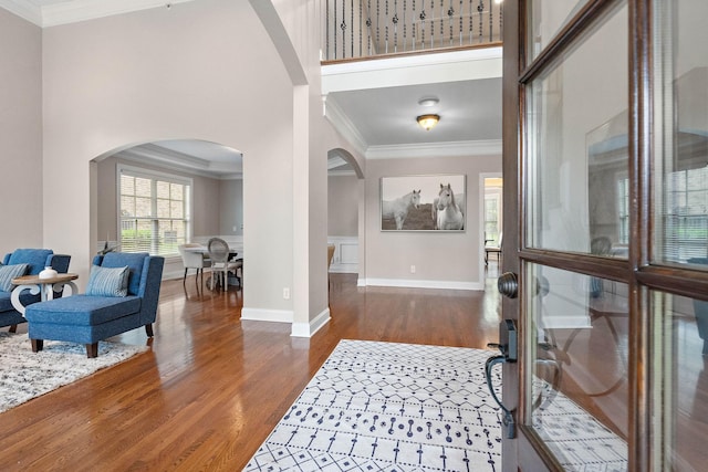 1005 Brittain Downs Dr, Nolensville, TN 37135 - foyer entrance with arched walkways, wood finished floors, crown molding, and baseboards
