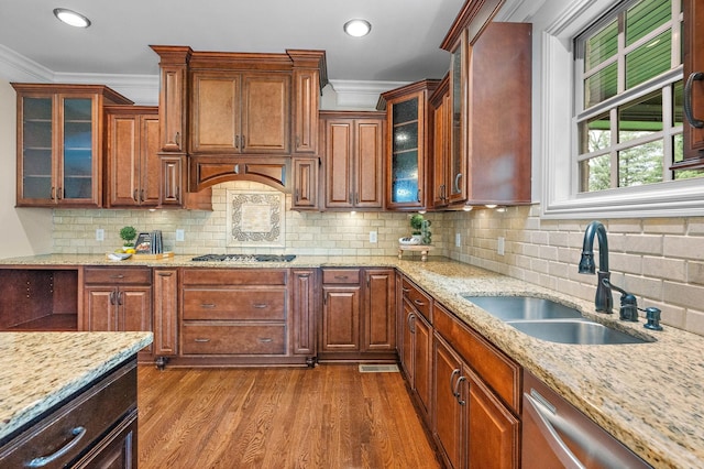 1005 Brittain Downs Dr, Nolensville, TN 37135 - kitchen featuring a sink, dark wood-style floors, stainless steel appliances, crown molding, and light stone counters