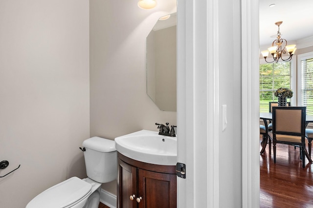 1005 Brittain Downs Dr, Nolensville, TN 37135 - bathroom with a chandelier, vanity, toilet, and wood finished floors