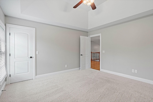 1005 Brittain Downs Dr, Nolensville, TN 37135 - carpeted empty room with ceiling fan, baseboards, a tray ceiling, and healthy amount of natural light
