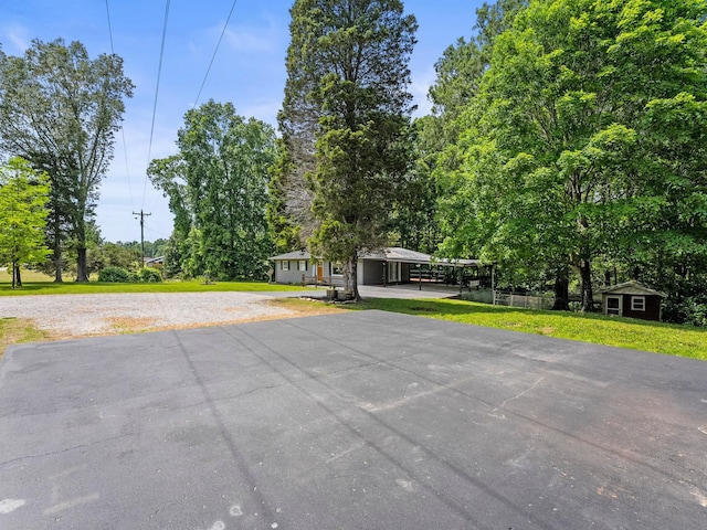 5538 Lexie Beans Creek Rd, Belvidere, TN 37306 - view of front of home featuring a front lawn, an outbuilding, and driveway
