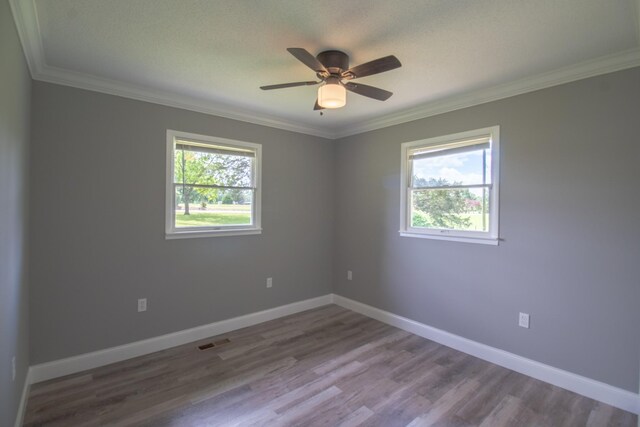 5538 Lexie Beans Creek Rd, Belvidere, TN 37306 - unfurnished room featuring crown molding, wood finished floors, baseboards, and ceiling fan