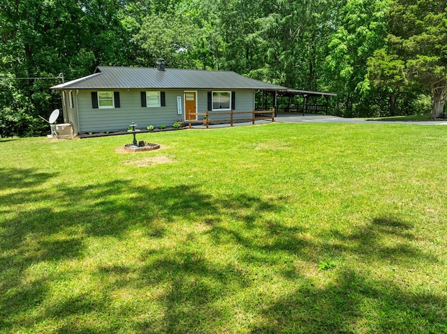 5538 Lexie Beans Creek Rd, Belvidere, TN 37306 - view of front of home featuring metal roof, a front yard, and a wooded view
