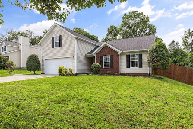 917 Lavergne Ln, La Vergne, TN 37086 - traditional home with a garage, driveway, brick siding, and roof with shingles
