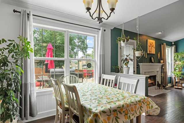 917 Lavergne Ln, La Vergne, TN 37086 - dining room featuring dark wood-style floors, a chandelier, a fireplace, and baseboards