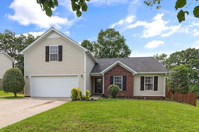 917 Lavergne Ln, La Vergne, TN 37086 - traditional-style house featuring driveway, an attached garage, roof with shingles, and brick siding