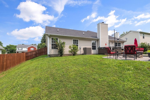 917 Lavergne Ln, La Vergne, TN 37086 - rear view of property with a patio area, central AC, and a chimney