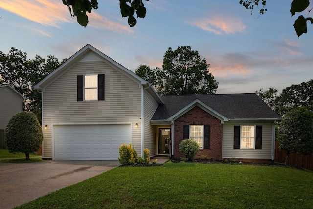 917 Lavergne Ln, La Vergne, TN 37086 - traditional-style home featuring a garage, concrete driveway, and brick siding