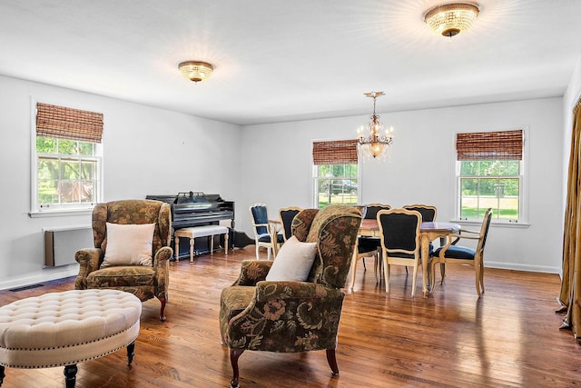 1899 Berrys Chapel Ct, Franklin, TN 37069 - living room featuring a chandelier, wood finished floors, and baseboards