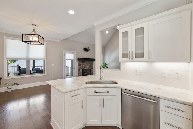 212 Lotus Ct, Hendersonville, TN 37075 - kitchen featuring dishwasher, a fireplace, a sink, tasteful backsplash, and a peninsula