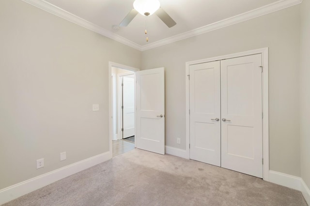 212 Lotus Ct, Hendersonville, TN 37075 - unfurnished bedroom featuring carpet, crown molding, baseboards, a closet, and a ceiling fan