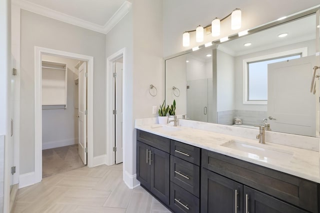 212 Lotus Ct, Hendersonville, TN 37075 - bathroom featuring ornamental molding, a spacious closet, double vanity, a stall shower, and baseboards