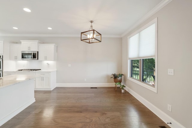 212 Lotus Ct, Hendersonville, TN 37075 - unfurnished dining area with a chandelier, ornamental molding, wood finished floors, baseboards, and recessed lighting