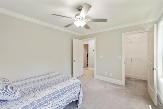 212 Lotus Ct, Hendersonville, TN 37075 - bedroom featuring light carpet, ornamental molding, baseboards, a walk in closet, and ceiling fan